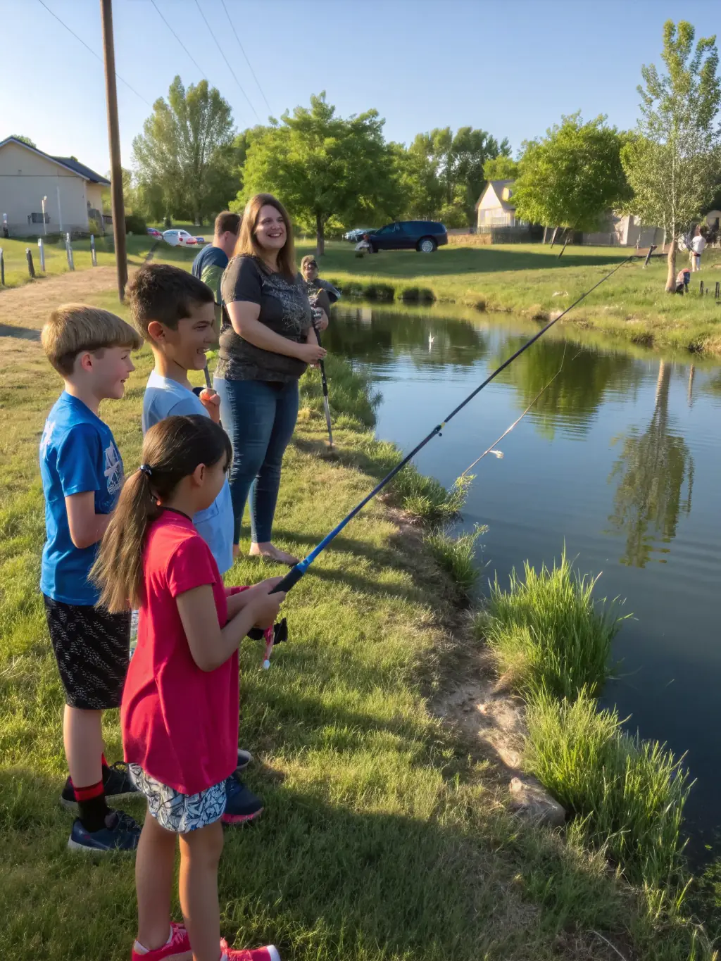 A picture of children participating in a fishing workshop organized by LE GUERNOUILLET, highlighting the club's commitment to educating the younger generation about fishing and environmental conservation.